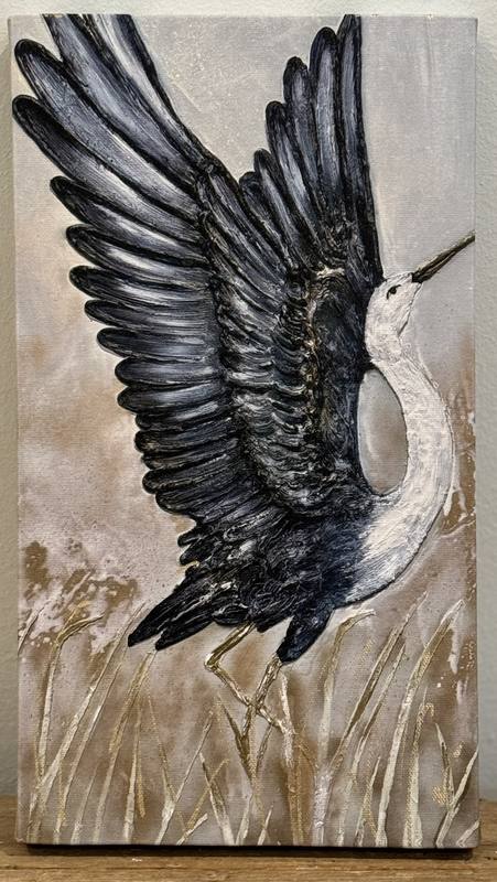 Artwork depicting a bird in flight with spread wings against a muted background, surrounded by delicate grasses.