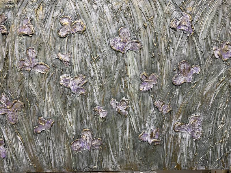 Textured artwork depicting stylized flowers in varying shades of purple against a layered green background, suggesting a serene natural landscape.